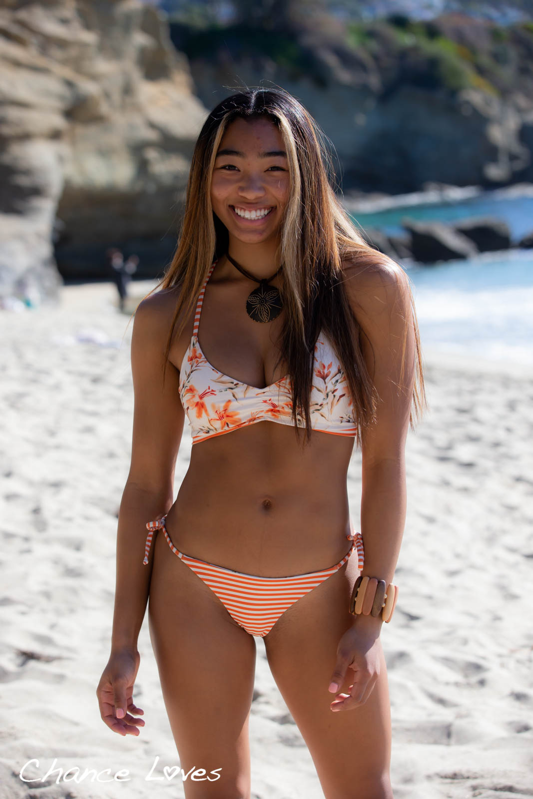 Orange white Cheeky style swim bottoms reversible with side ties adjustable