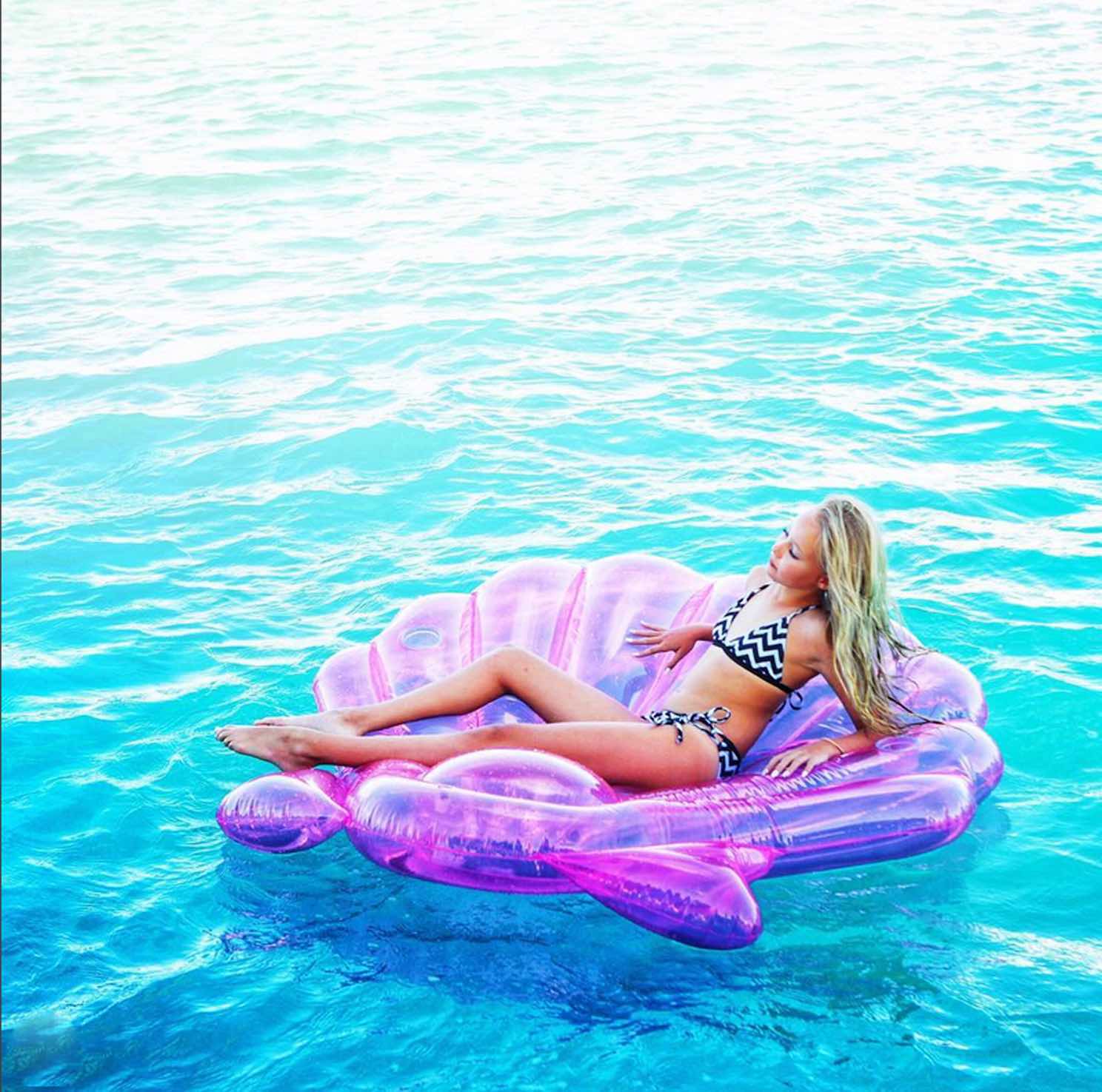 Girl on float in a pool wearing a trendy tween bikini with Triangle Top 2-Piece size 10