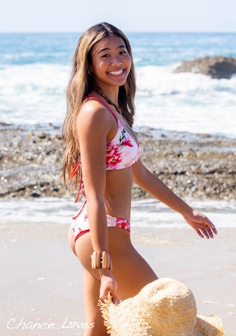 happy smiles wearing a sustainable reversible Chance bikini