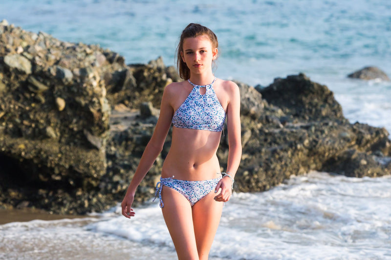 Taking walks in the sunset on the beautiful shore in the Daisy Blue Girls Bikini Set with Halter Top - Chance Loves Swimwear