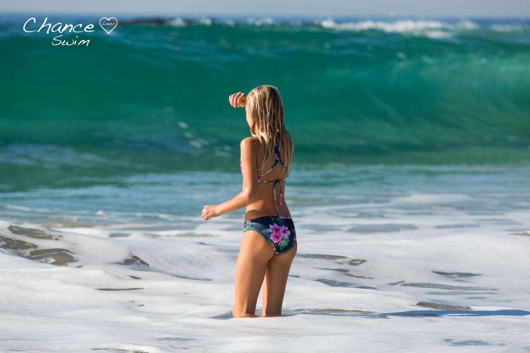 Taking on the the big surf in the Tropical Bay Tween Girls Bikini Set - Chance Loves Swimwear