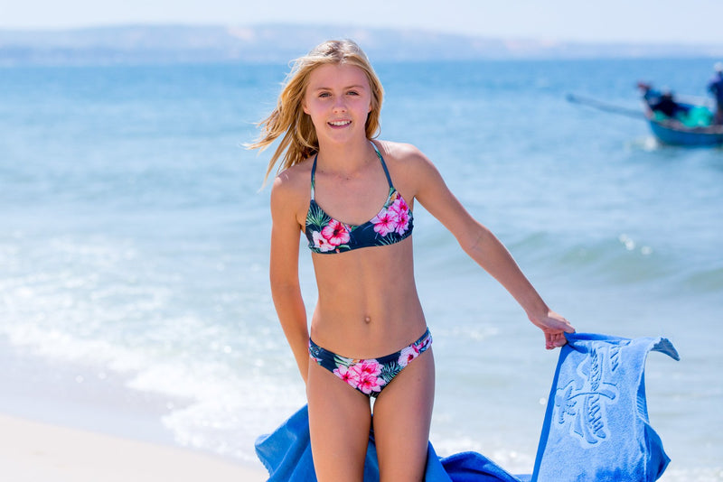 Having fun at the beach wearing the Tropical Bay Tween Girls Bikini Set - Chance Loves Swimwear